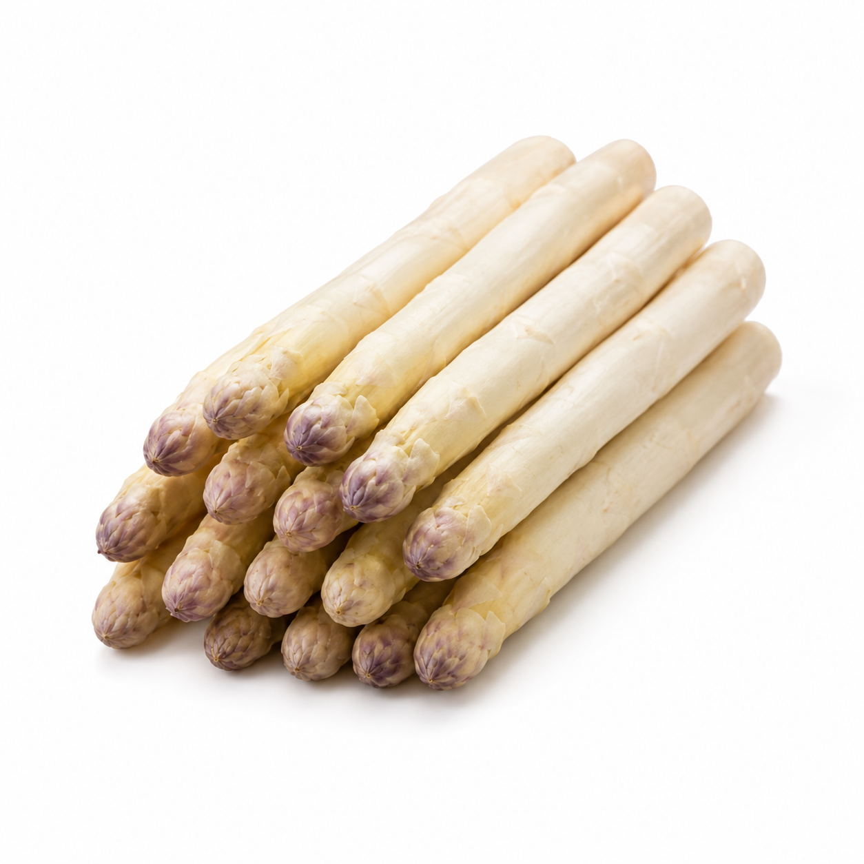 White asparagus spears emerging from soil with fern-like foliage – perennial asparagus seeds for home gardening in Pakistan