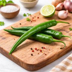 Long green chillies growing on healthy plants – Green Chilli Long F1 Hybrid seeds for winter and summer kitchen gardening in Pakistan
